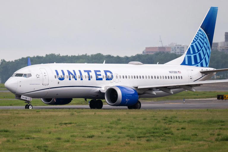 Read more about the article United Airlines suspends nationwide flights due to a safety alarm. By Katy Moore.