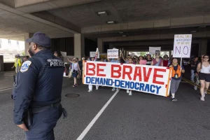 Read more about the article Trump officials agree to maintain DC police chief, but enforce immigration order. Katy Moore.