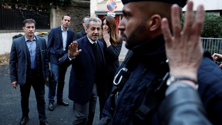 Read more about the article Police accompany former French President Nicolas Sarkozy to prison to begin his five-year sentence. By Lisa Lomami.